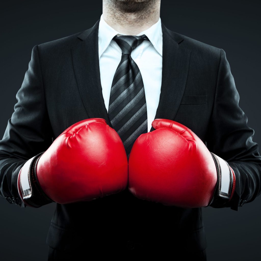 businessman in boxing gloves isolated on gray