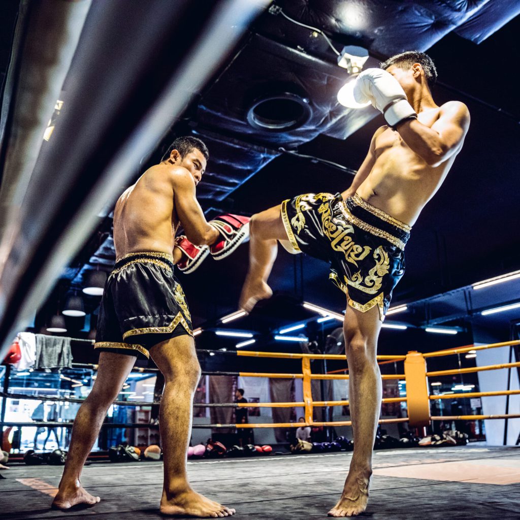 Muay Thai athletes training on the boxing ring